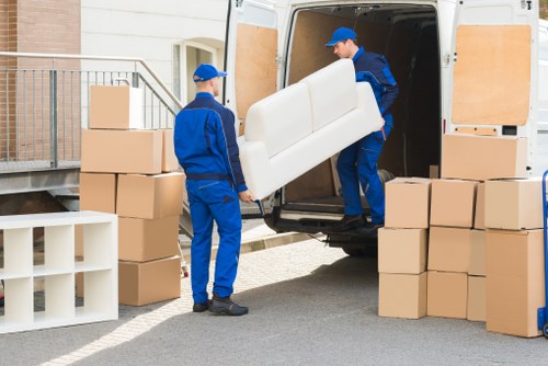 Driver assisting with furniture delivery on Elmpark streets