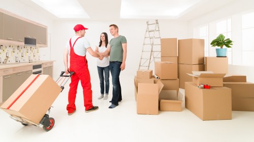 Furniture being carried from an Elmpark property during relocation