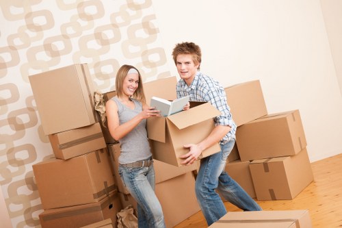 Organised office relocation process with labelled boxes and furniture placement
