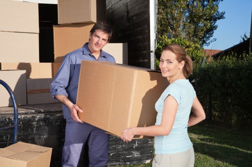Office furniture and equipment being prepared for a commercial move