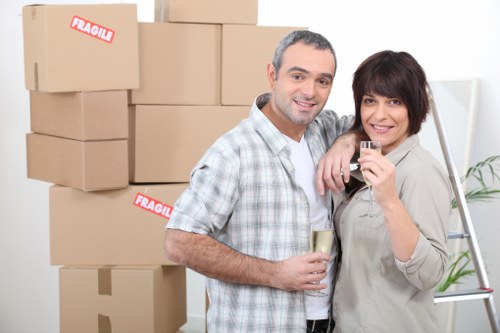 Loading household furniture into a removals van in Elmpark